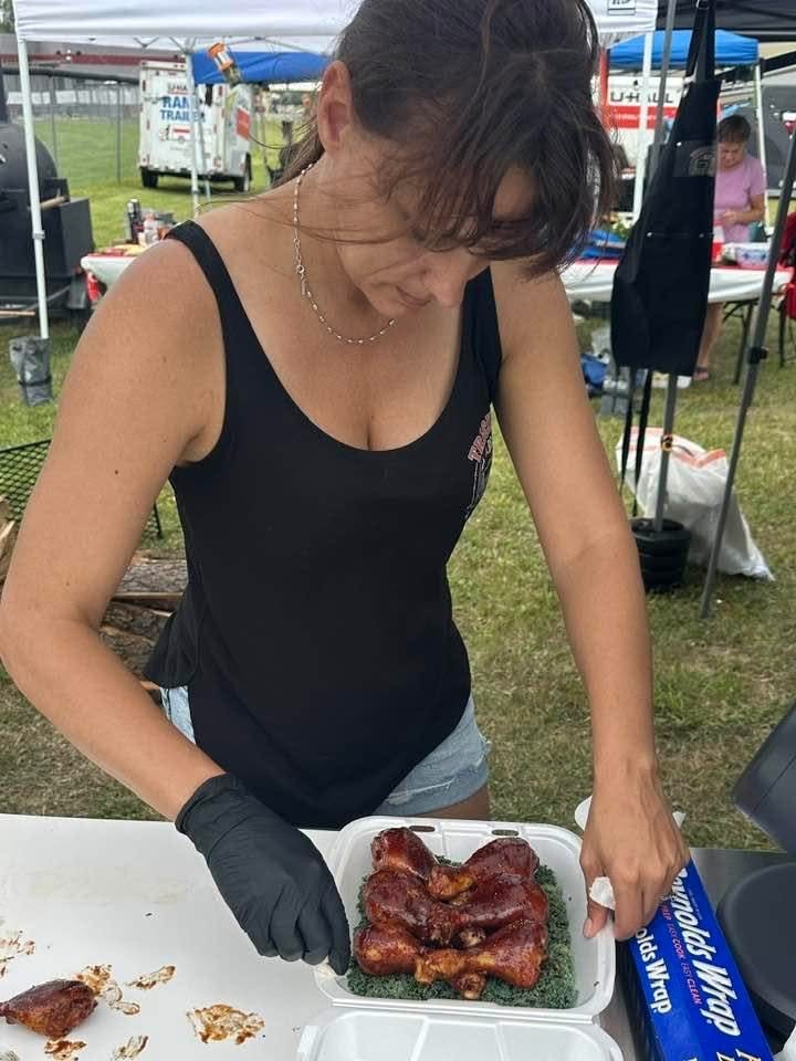 Serving grilled meat at outdoor event